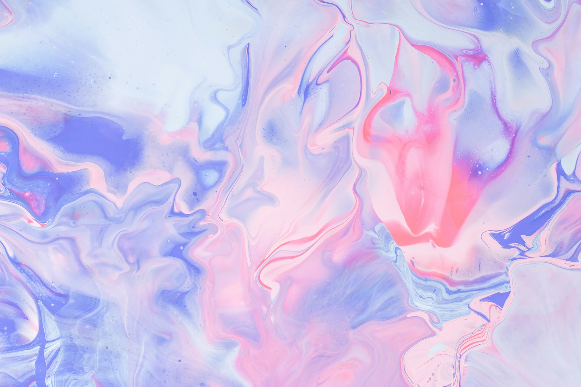 Abstract mixture of pink and violet watercolor paint. Photo by Pawel Czerwinski.